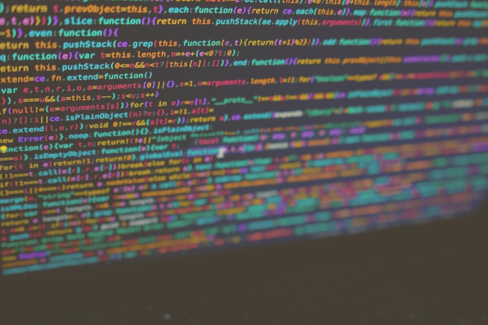 Student working on Python game code with visual output on screen